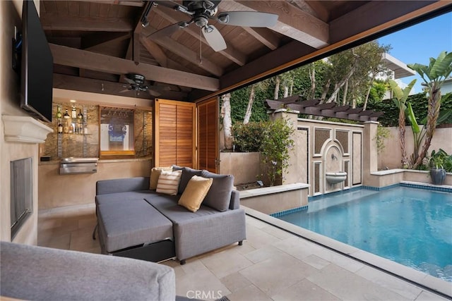view of swimming pool featuring a ceiling fan, an outdoor structure, a storage unit, fence, and a patio area