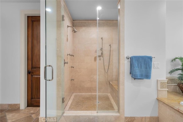 full bath featuring a shower stall