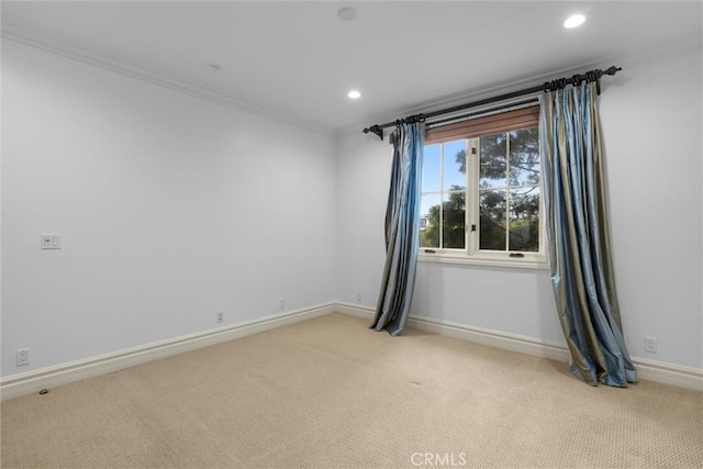 unfurnished room featuring light carpet, baseboards, recessed lighting, and crown molding
