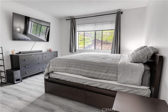 3955 Faircross Pl Unit 48, San Diego, CA 92115 - bedroom with a textured ceiling and wood finished floors