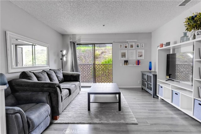 3955 Faircross Pl Unit 48, San Diego, CA 92115 - living room with a textured ceiling, visible vents, and wood finished floors