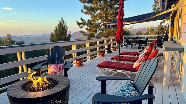 28935 Banff Dr, Lake Arrowhead, CA 92352 - wooden deck featuring outdoor dining area and a fire pit