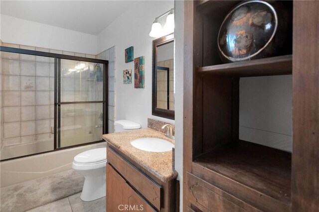 28935 Banff Dr, Lake Arrowhead, CA 92352 - full bath featuring vanity, toilet, bath / shower combo with glass door, and tile patterned floors