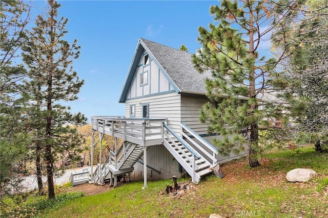 28935 Banff Dr, Lake Arrowhead, CA 92352 - rear view of house featuring stairway, roof with shingles, and a deck