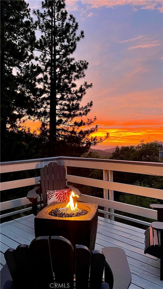 28935 Banff Dr, Lake Arrowhead, CA 92352 - wooden deck with a fire pit