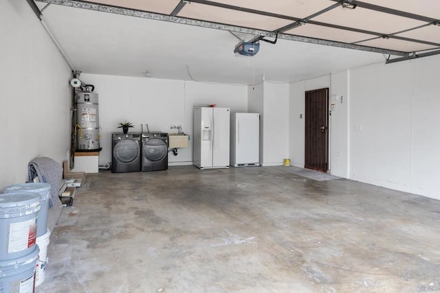 garage with freestanding refrigerator, white refrigerator with ice dispenser, strapped water heater, a garage door opener, and separate washer and dryer