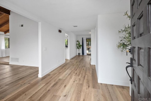entryway with light wood-style flooring, plenty of natural light, and visible vents