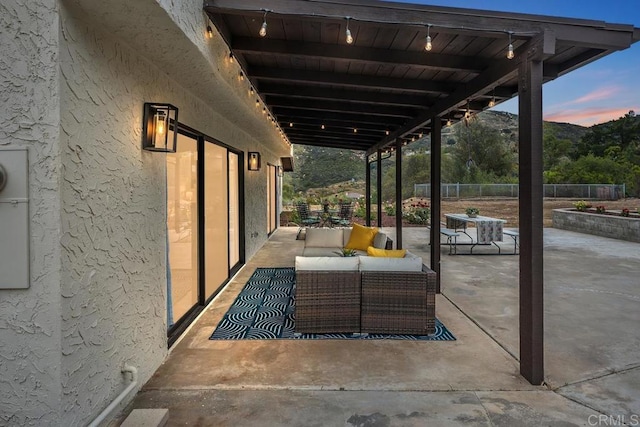 patio terrace at dusk with outdoor lounge area