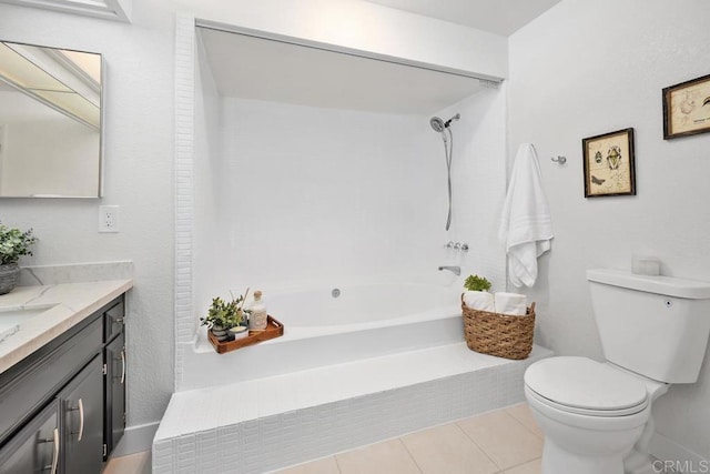 bathroom with vanity, toilet,  shower combination, and tile patterned flooring