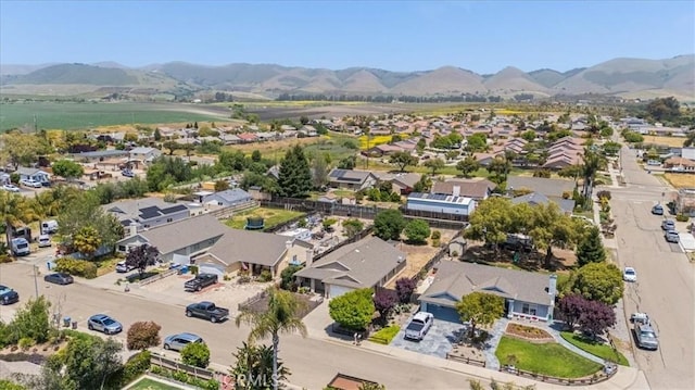 birds eye view of property featuring a mountain view and a residential view