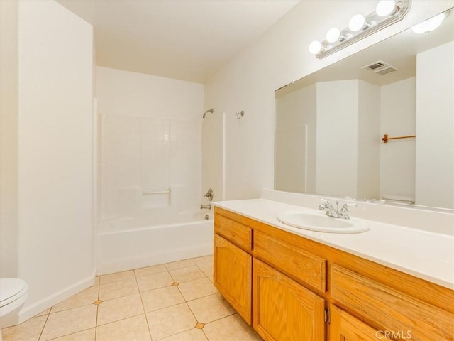 bathroom featuring toilet, vanity, visible vents, tile patterned floors, and bathtub / shower combination