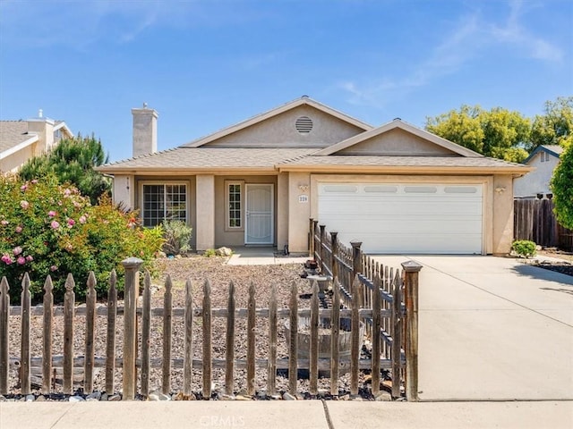 ranch-style house with a chimney, driveway, stucco siding, and a fenced front yard
