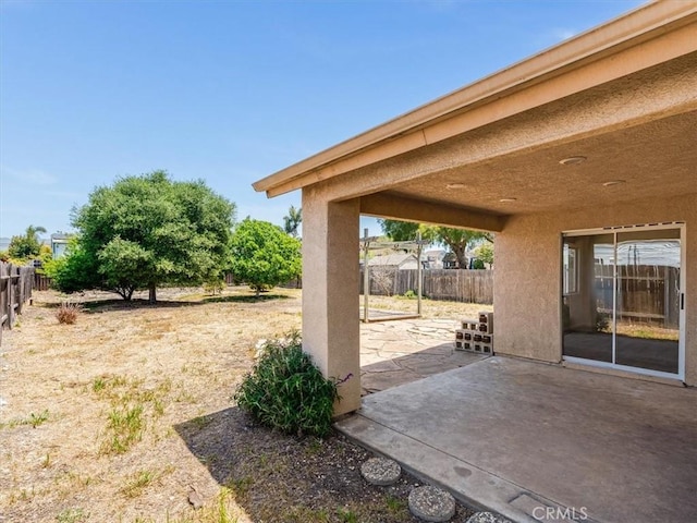 exterior space with a fenced backyard and a patio