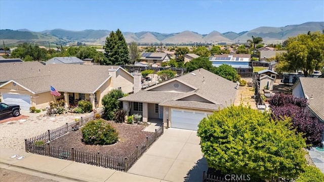 birds eye view of property featuring a mountain view and a residential view