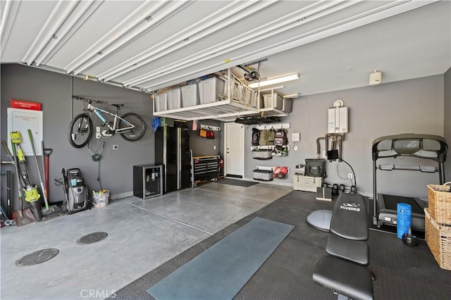 29034 Via Patina, Valencia, CA 91354 - garage featuring a garage door opener and freestanding refrigerator