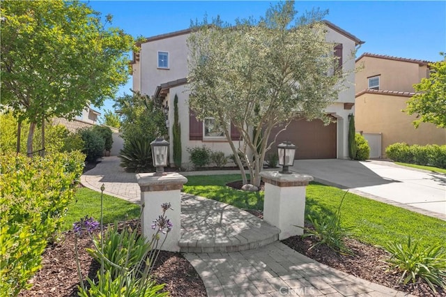 29034 Via Patina, Valencia, CA 91354 - view of front facade featuring driveway, stucco siding, and a garage