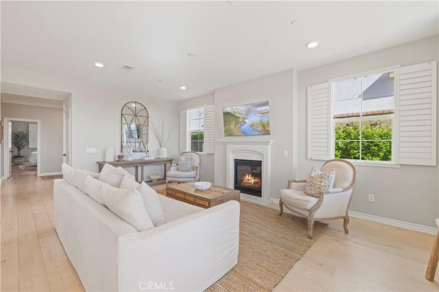 29034 Via Patina, Valencia, CA 91354 - living area featuring light wood-type flooring, a glass covered fireplace, and recessed lighting