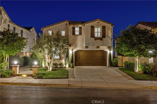 29034 Via Patina, Valencia, CA 91354 - mediterranean / spanish home featuring driveway, stucco siding, and an attached garage