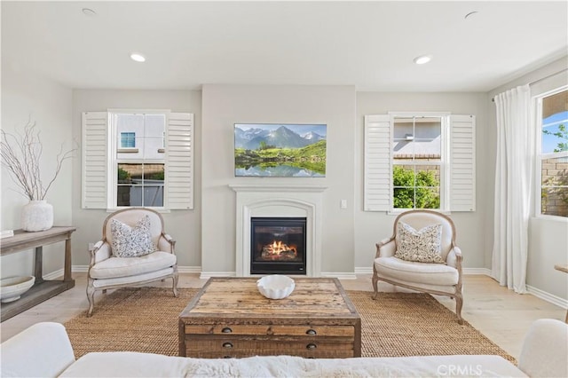 29034 Via Patina, Valencia, CA 91354 - living area featuring a glass covered fireplace, wood finished floors, and recessed lighting