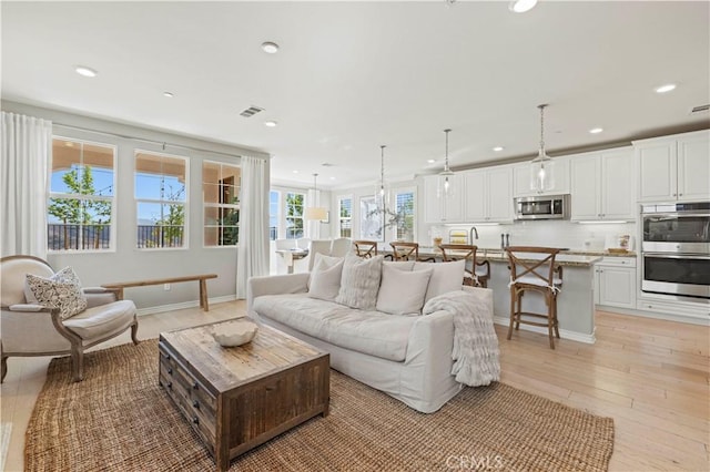29034 Via Patina, Valencia, CA 91354 - living room featuring recessed lighting and light wood-type flooring