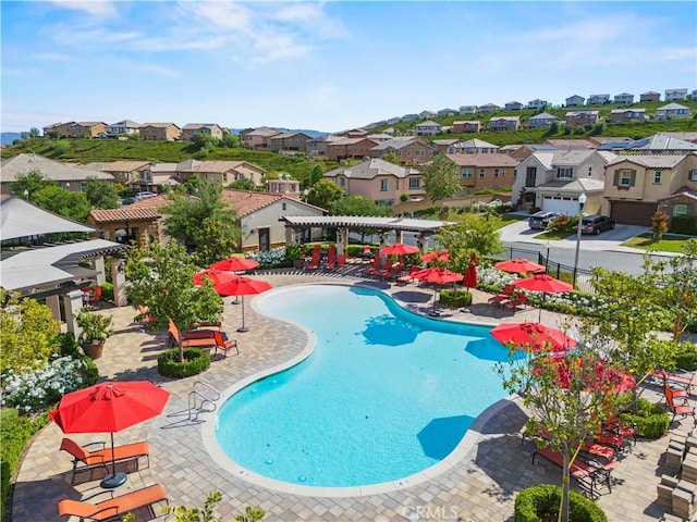 29034 Via Patina, Valencia, CA 91354 - community pool featuring a residential view, a pergola, and a patio