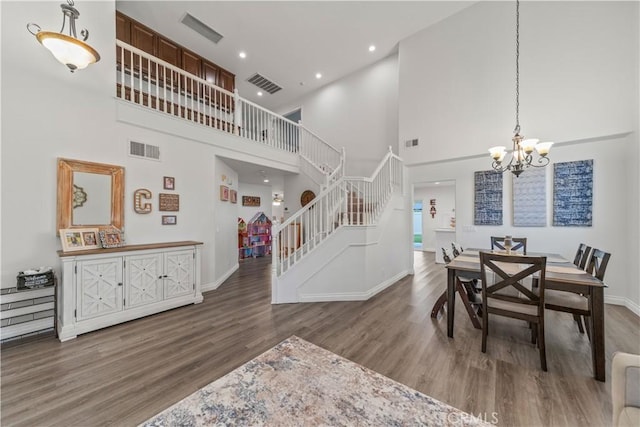 28823 Tonya St, Murrieta, CA 92563 - dining space featuring visible vents, a towering ceiling, and stairs