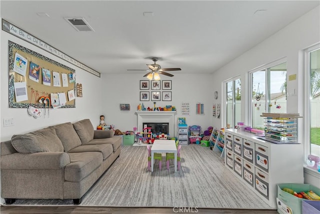 28823 Tonya St, Murrieta, CA 92563 - living area featuring a wealth of natural light, visible vents, wood finished floors, and ceiling fan