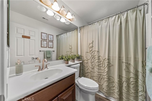 28823 Tonya St, Murrieta, CA 92563 - bathroom with vanity, toilet, visible vents, and wood finished floors