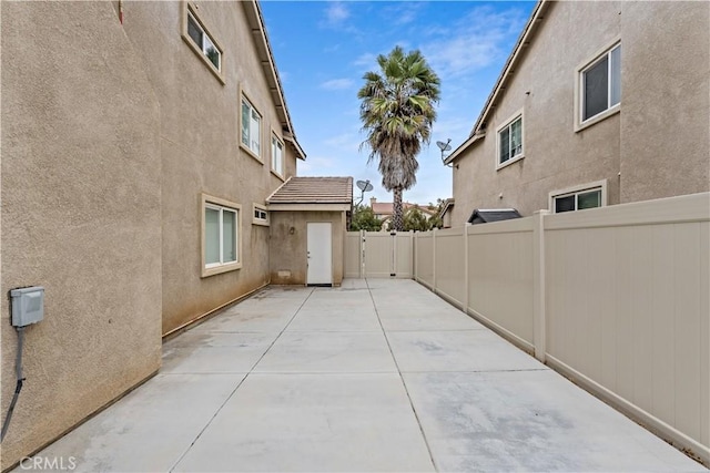 28823 Tonya St, Murrieta, CA 92563 - view of home's exterior with fence, a patio, and stucco siding