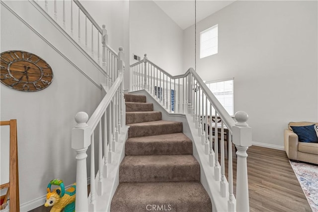 28823 Tonya St, Murrieta, CA 92563 - stairs featuring baseboards, high vaulted ceiling, and wood finished floors