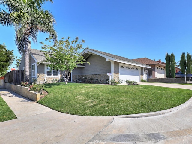 22661 Claude Cir, Lake Forest, CA 92630 - ranch-style home featuring stone siding, an attached garage, and driveway