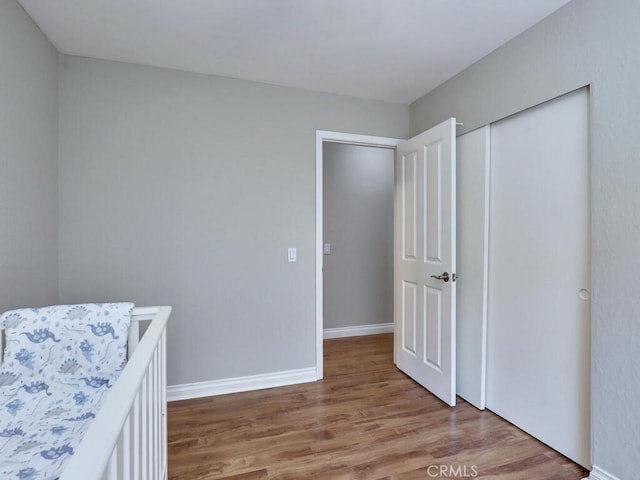 22661 Claude Cir, Lake Forest, CA 92630 - bedroom featuring light wood-style floors and a closet