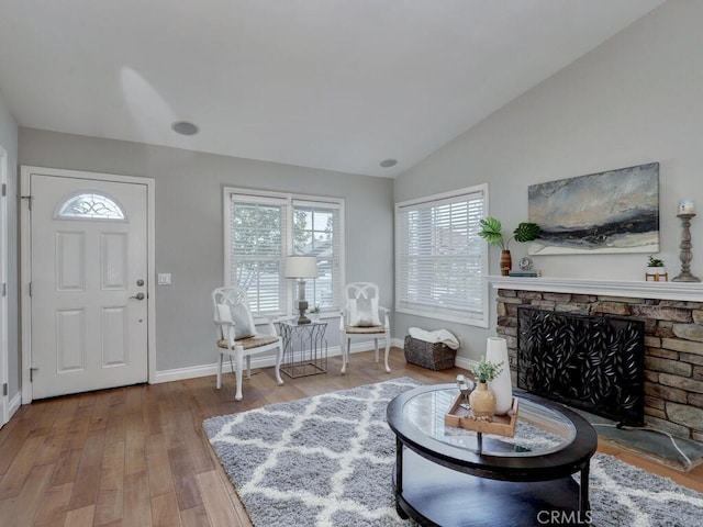 22661 Claude Cir, Lake Forest, CA 92630 - living room with plenty of natural light, wood finished floors, lofted ceiling, and a stone fireplace