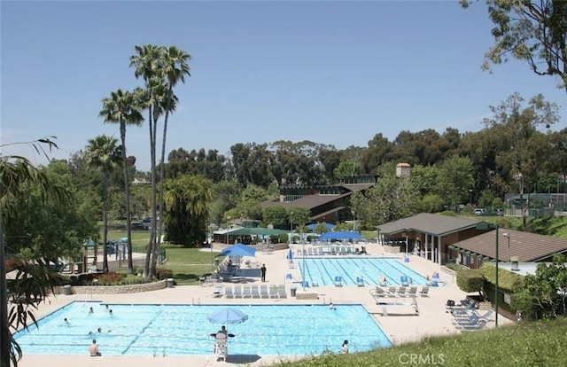 22661 Claude Cir, Lake Forest, CA 92630 - community pool featuring a patio and view of scattered trees