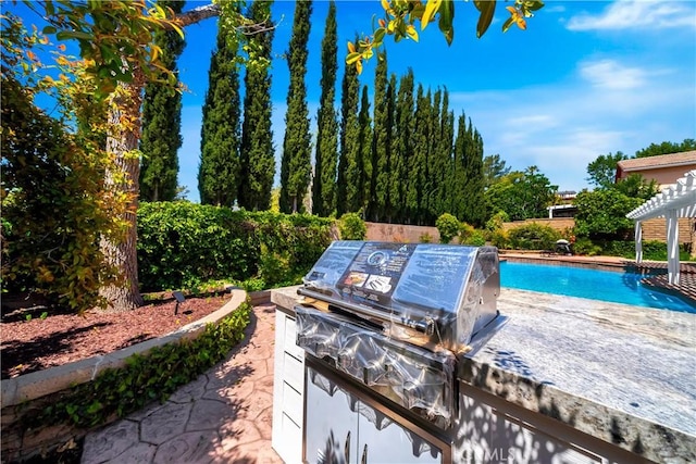 1760 N Yurok St, Orange, CA 92867 - view of pool with a patio area, an outdoor kitchen, a pergola, and a fenced in pool