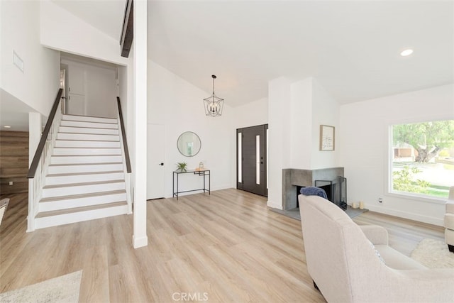 1760 N Yurok St, Orange, CA 92867 - living room featuring stairway, light wood-type flooring, high vaulted ceiling, baseboards, and recessed lighting