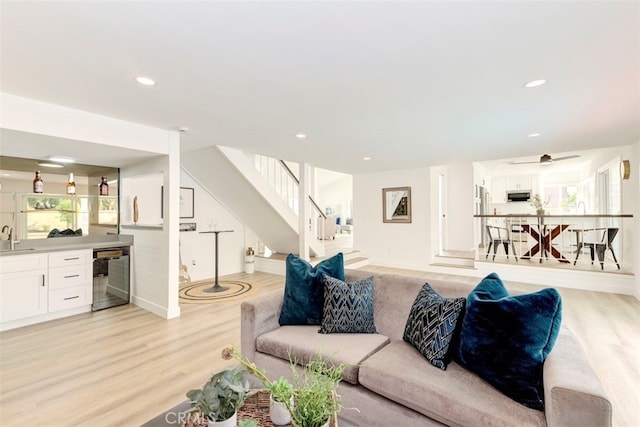 1760 N Yurok St, Orange, CA 92867 - living area with beverage cooler, light wood-type flooring, stairs, healthy amount of natural light, and recessed lighting