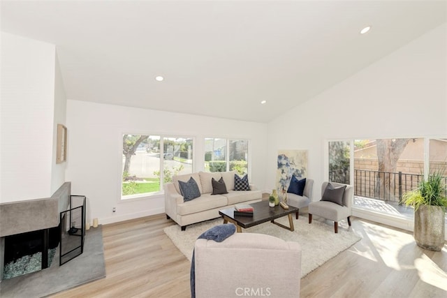 1760 N Yurok St, Orange, CA 92867 - living room with light wood finished floors, baseboards, high vaulted ceiling, and recessed lighting