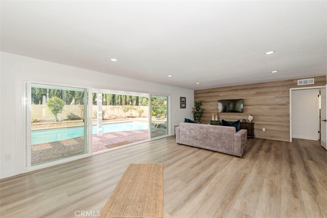 1760 N Yurok St, Orange, CA 92867 - living room featuring recessed lighting, plenty of natural light, and wood finished floors