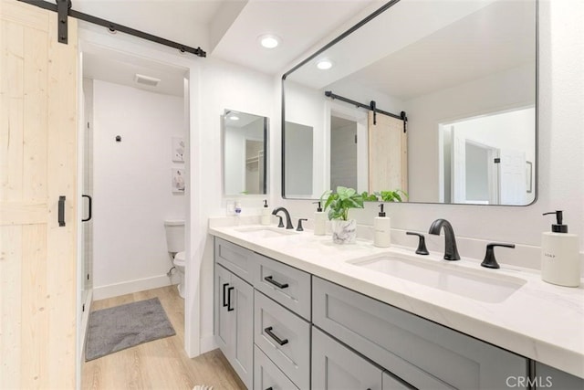 1760 N Yurok St, Orange, CA 92867 - full bathroom with wood finished floors, toilet, recessed lighting, double vanity, and baseboards