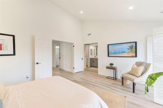 1760 N Yurok St, Orange, CA 92867 - bedroom with light wood finished floors, high vaulted ceiling, baseboards, ensuite bath, and recessed lighting