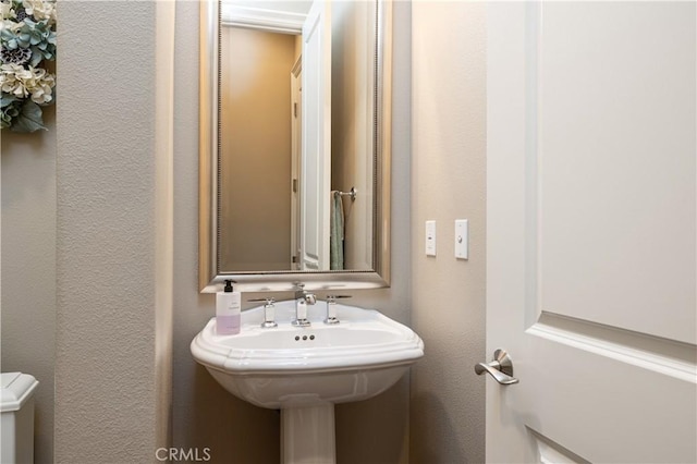 bathroom with a textured wall