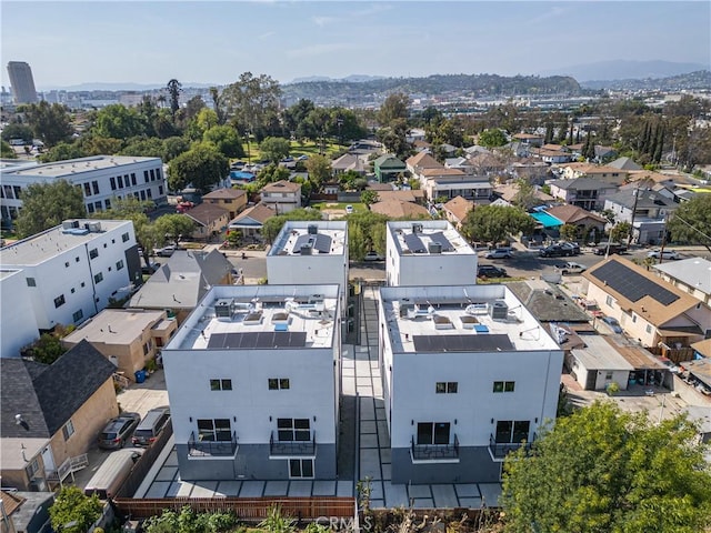 birds eye view of property with a mountain view