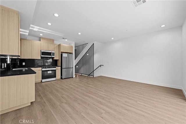 kitchen with light brown cabinets, light wood-type flooring, visible vents, appliances with stainless steel finishes, and recessed lighting