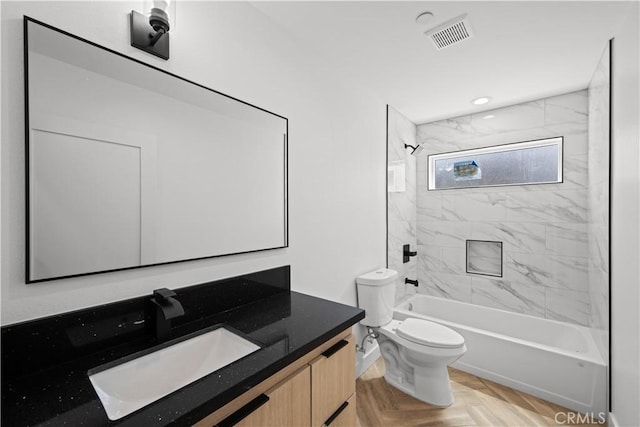 full bathroom featuring toilet, vanity, visible vents, recessed lighting, and shower / bath combination