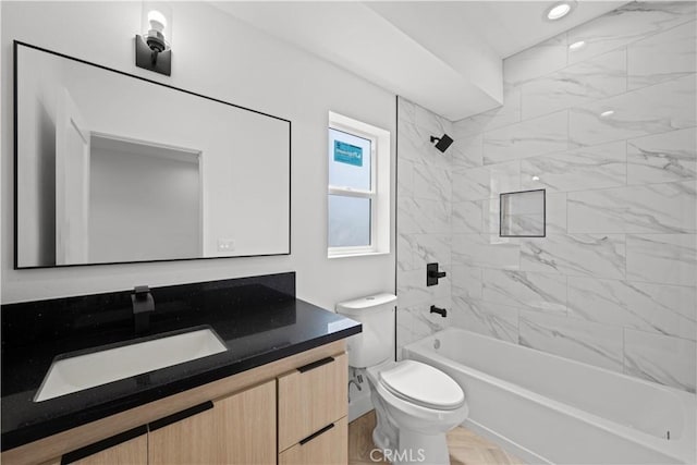 bathroom featuring vanity, toilet, and bathtub / shower combination