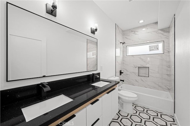 full bathroom featuring double vanity, toilet, washtub / shower combination, and a sink