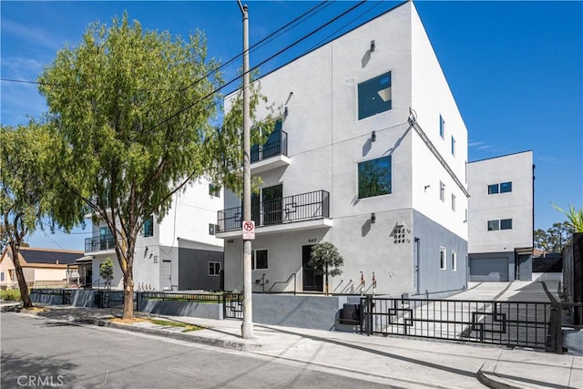view of building exterior with fence private yard