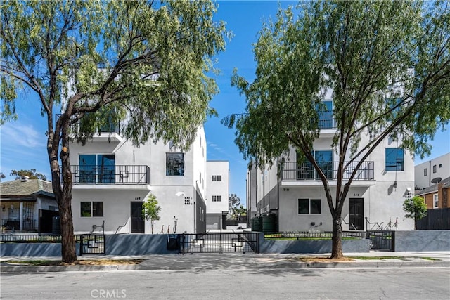 view of building exterior featuring a fenced front yard