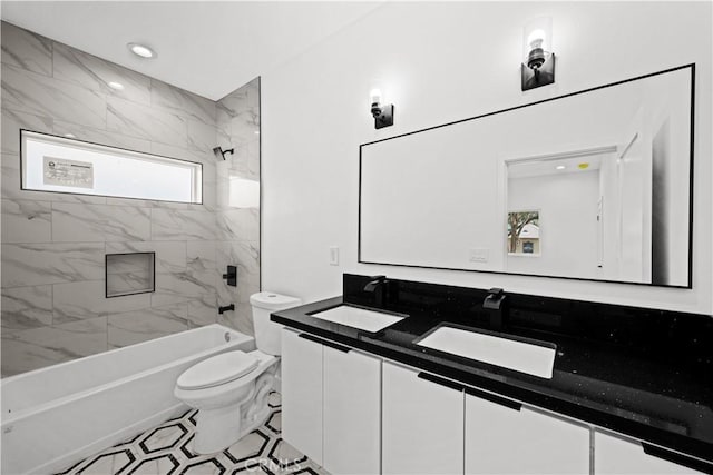 full bath featuring double vanity, toilet, shower / washtub combination, and a sink